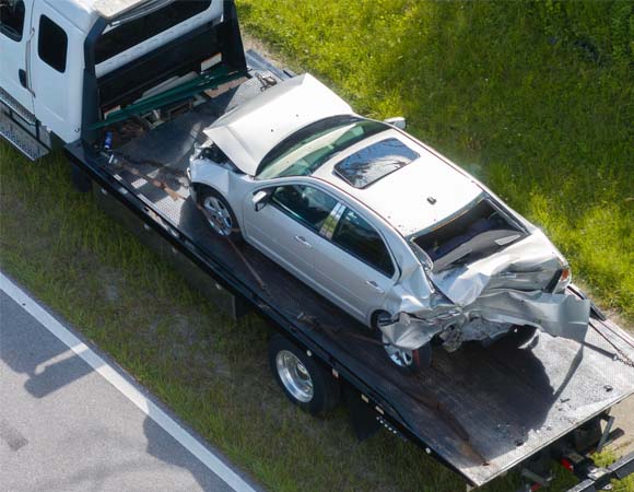 spokane valley car wreck showing car and tow truck